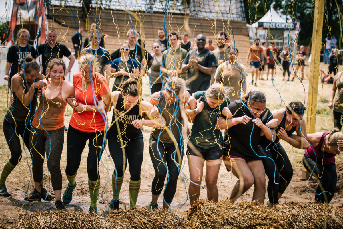 Participants linking arms while going through Electroshock Therapy