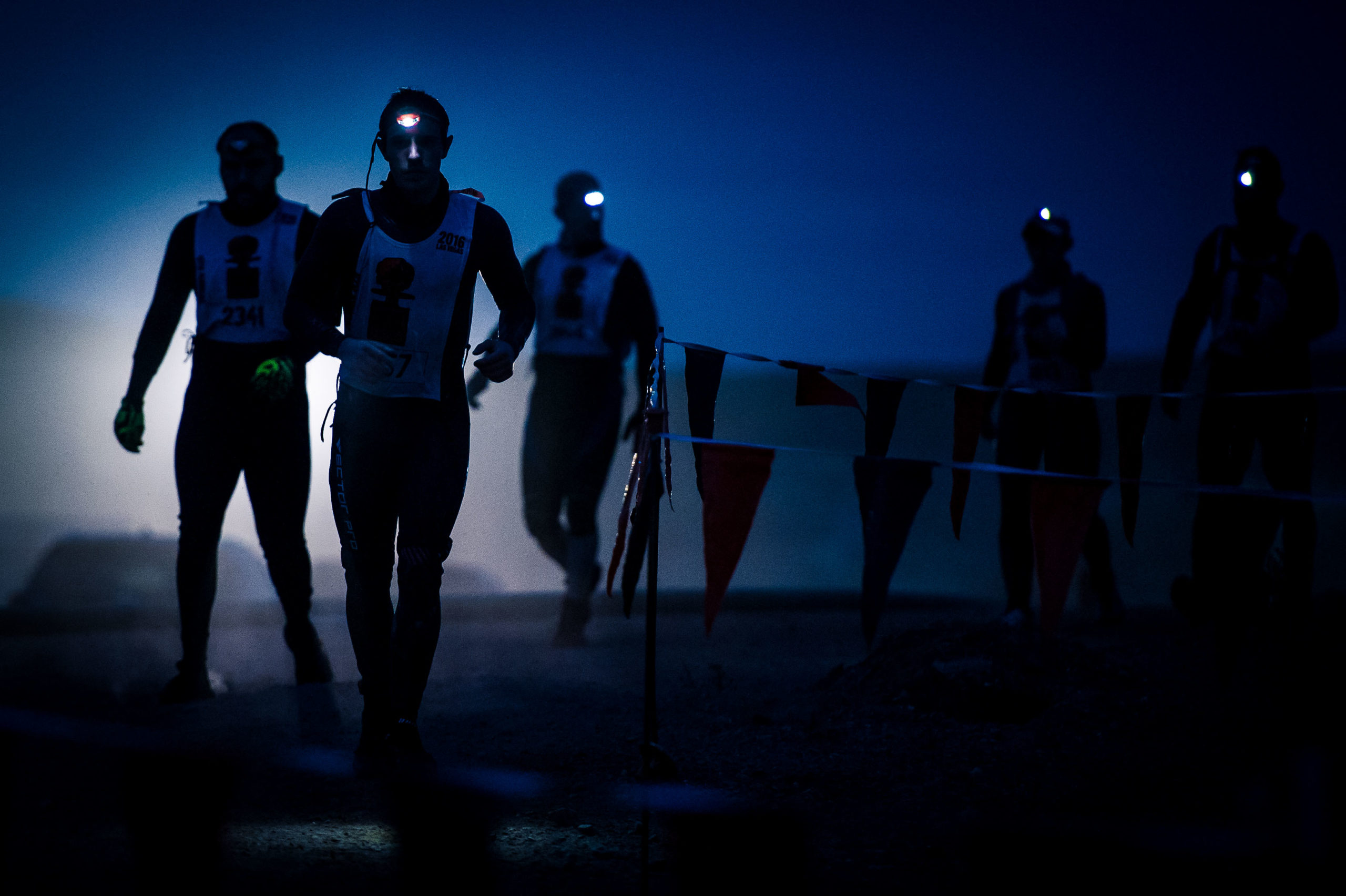 Participants running in the dark with flashlights in their heads