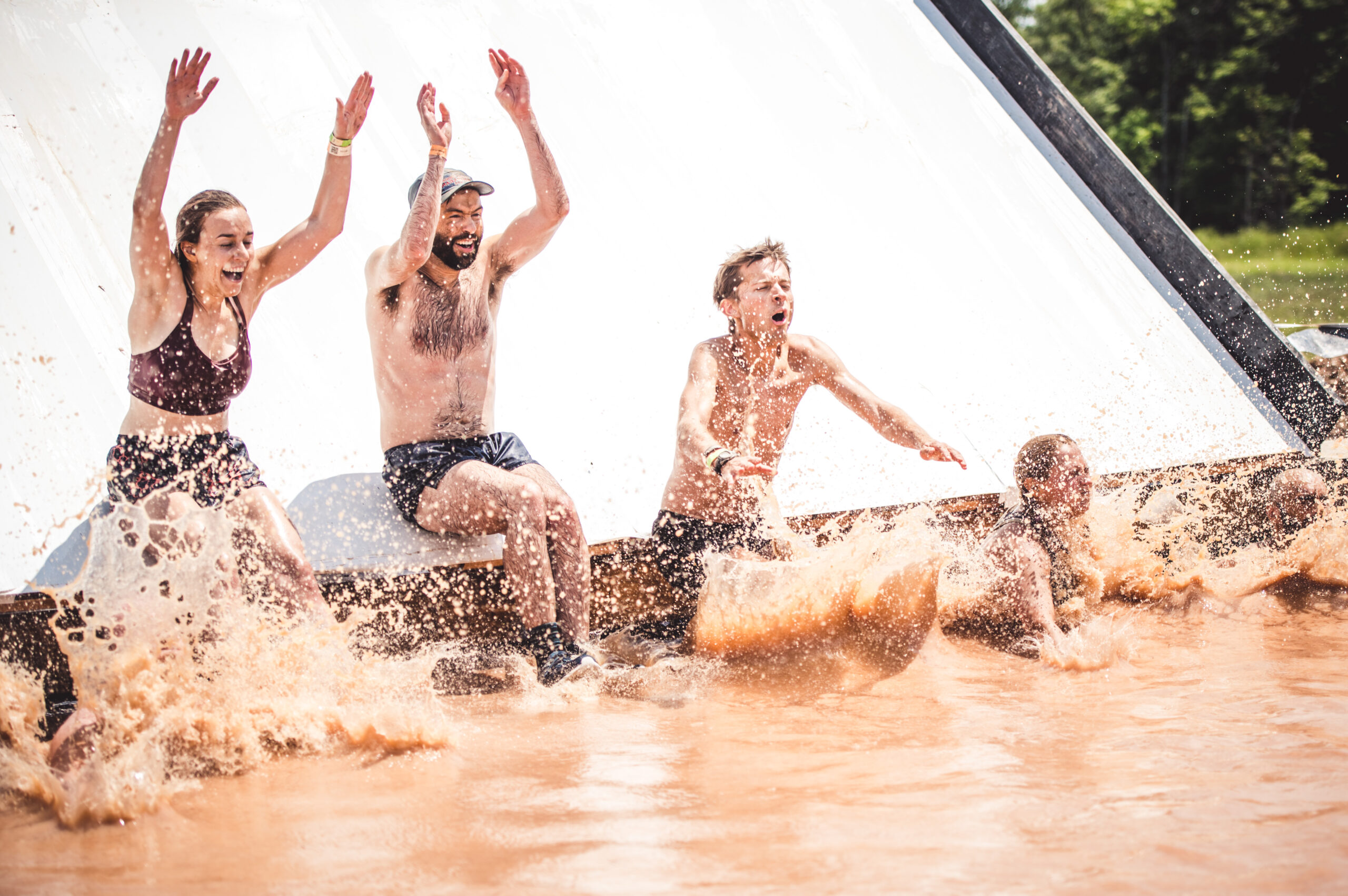 water obstacle people jumping in