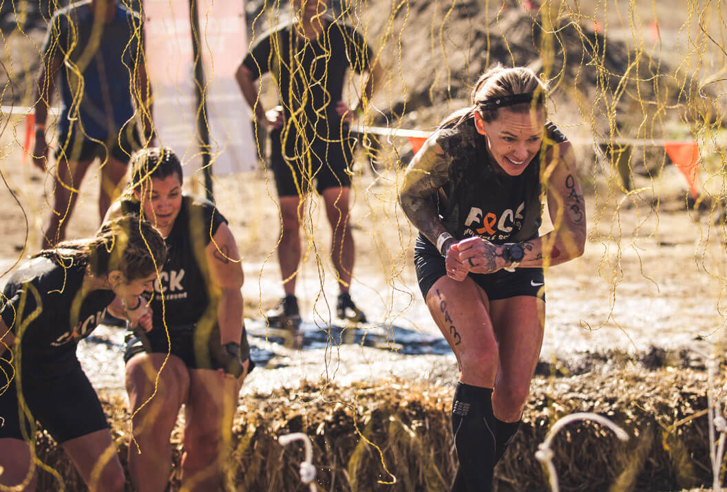 Participants walking extra careful through electric wires of Electroshock Therapy