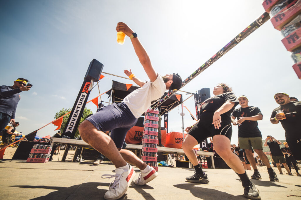 people doing limbo competition at Tough Mudder LA event